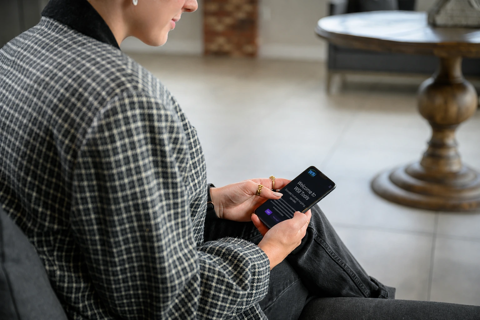 A person opening the WSI portal on a phone
